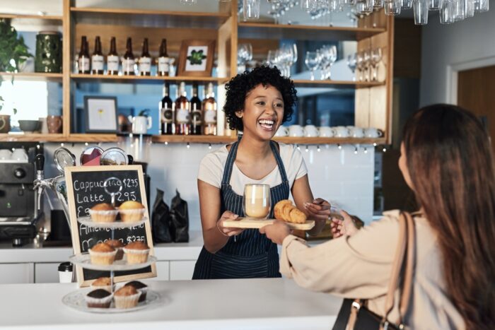 Small business owner interacting with a client.