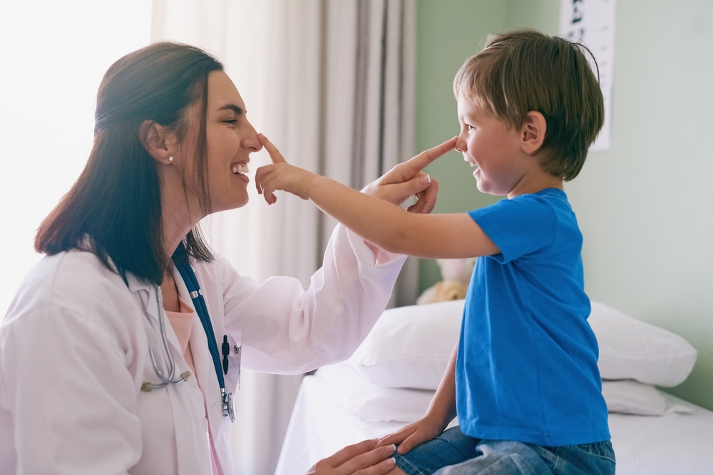 pediatrician interacting with a patient