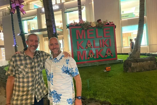 Ryan Beck and Tim Mesaric in front of the Royal Hawaiian shopping center in Waikiki.