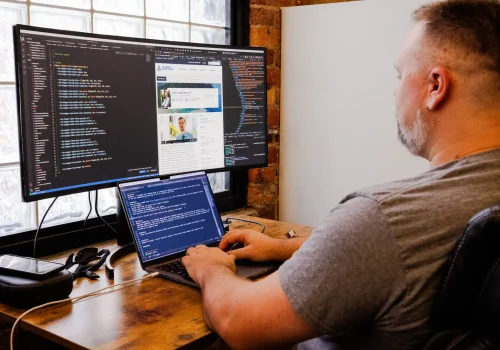 Christopher Brooks coding a website in the Beck Greenville office