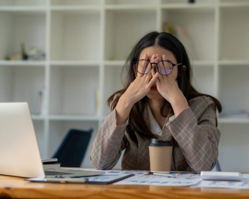 Tired,Business,Woman,Sleepy,And,Bored,From,Sitting,At,A