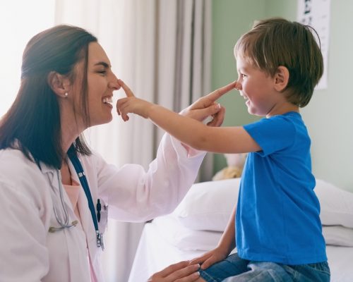 pediatrician interacting with a patient