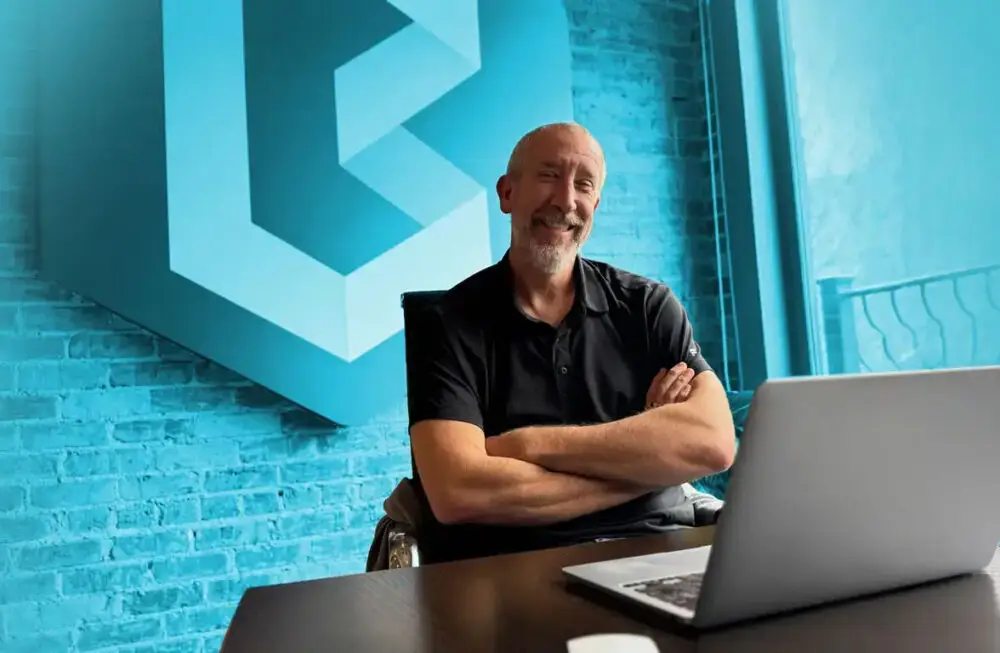 Tim Mesaric behind a desk in the BECK office